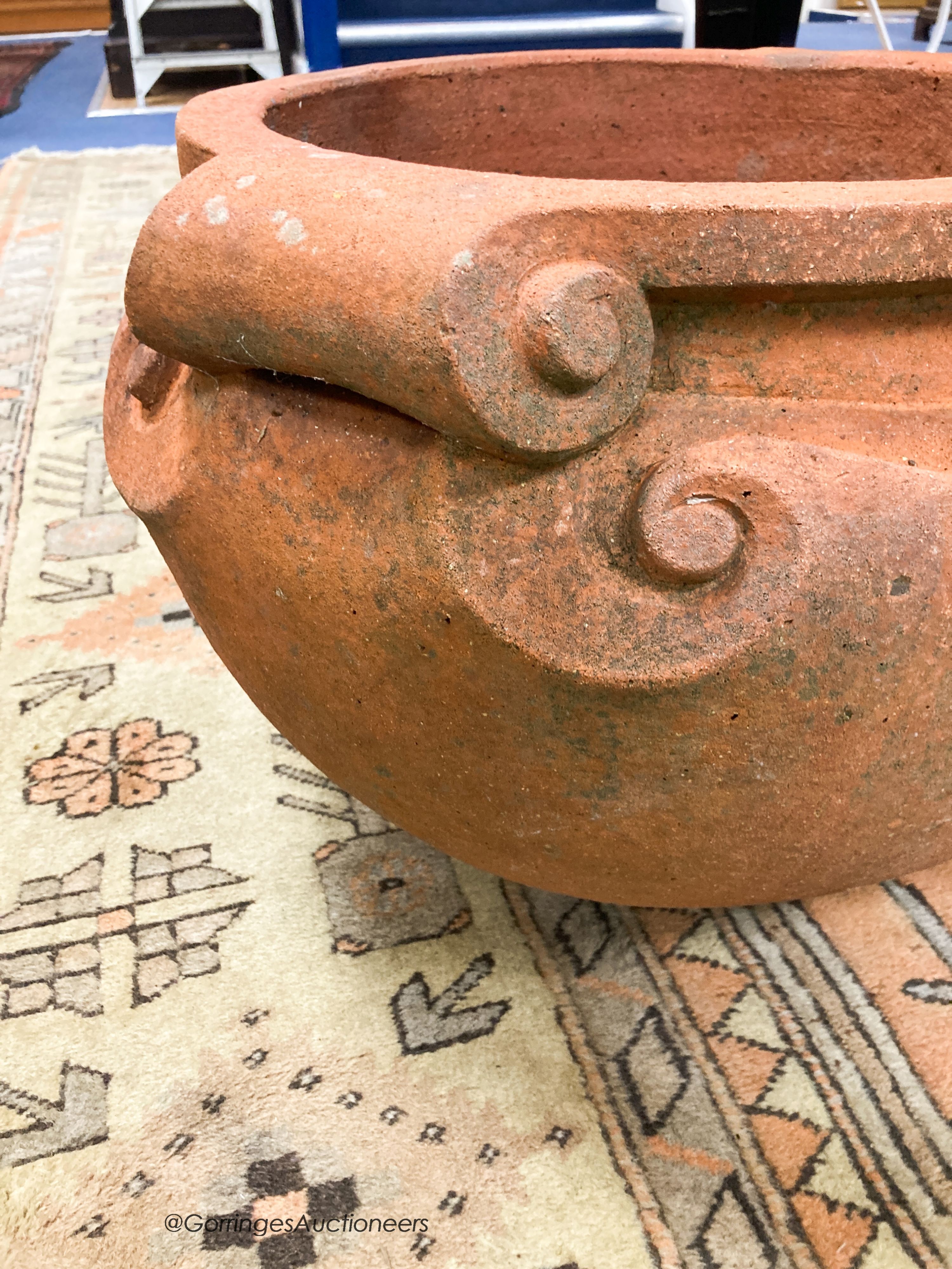 A Compton pottery terracotta scroll garden planter, impress marks, 50cm diameter, height 37cm